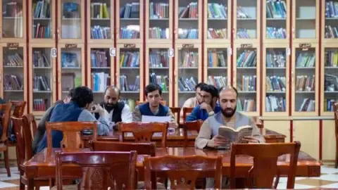 Afghanistan's rulers prohibit publications produced by women from the nation's colleges